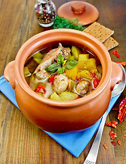 Image showing Roast chicken in a clay pot with hot pepper