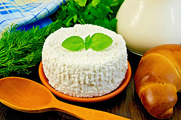 Image showing Curd with spoon and bagel on the board