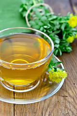 Image showing Herbal tea with Rhodiola Rosea on a wooden board