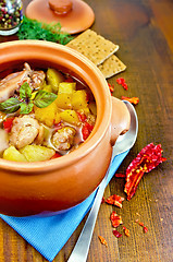 Image showing Roast chicken in a clay pot on a napkin