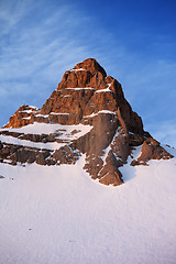 Image showing Snowy rocks at sunrise