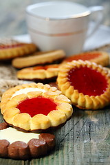 Image showing Cup and biscuit with jelly filling.