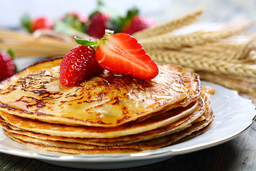 Image showing Pancakes with honey.