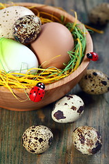 Image showing Easter eggs in a bowl on old wooden. 