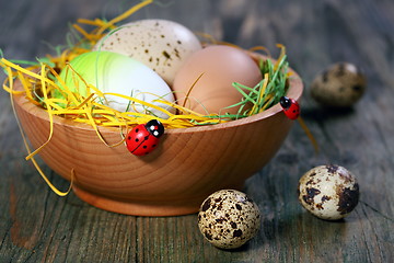 Image showing Easter eggs in a wooden bowl.