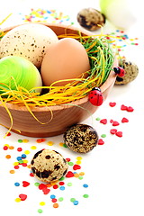 Image showing Colorful Easter eggs and cake decorations.