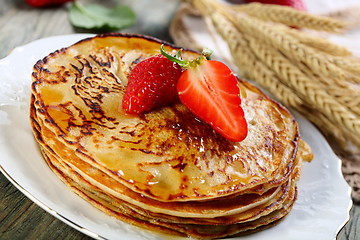Image showing Pancakes with honey sauce.