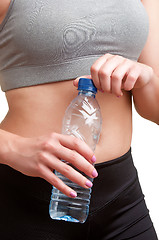 Image showing Woman Holding Bottle of Water