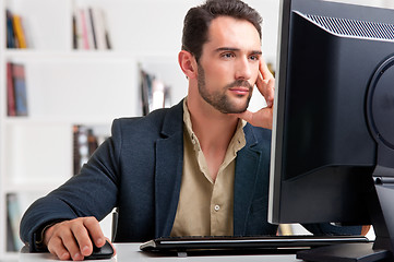 Image showing Man Looking At A Computer Monitor