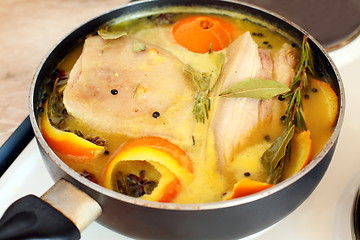 Image showing Pork loin in orange juice with spices.