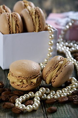 Image showing Macaroons in the box, pearls and coffee beans.