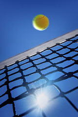 Image showing Tennis Ball over Net
