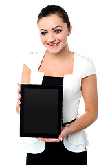 Image showing Pretty young girl showcasing a tablet device