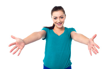 Image showing Welcoming young smiling girl