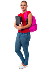 Image showing Pretty college student carrying pink backpack