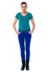 Image showing Pretty woman with hands in jeans pocket