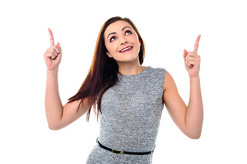 Image showing Amused young girl in sleeveless dress