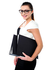 Image showing Young business professional posing with folders