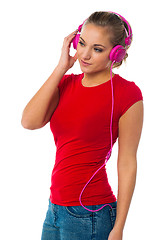 Image showing Girl listening to music through headphones