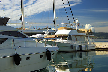 Image showing Luxury yachts moored on pier