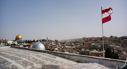 Image showing Austrian flag over old city