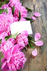 Image showing Pink peonies and card.
