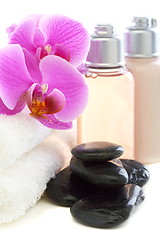 Image showing Cosmetics and towels with pink orchid.