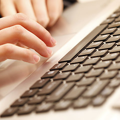 Image showing Young woman working on laptop