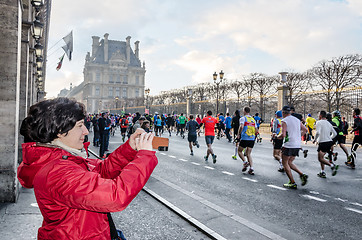 Image showing Spectators and participants of the annual Paris Marathon on the 