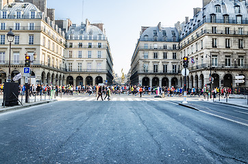 Image showing Spectators and participants of the annual Paris Marathon on the 