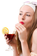 Image showing Caucasian woman drinks unrecognizable cocktail