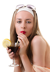 Image showing Caucasian woman drinks unrecognizable cocktail