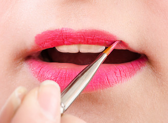 Image showing Beautician artist applying makeup