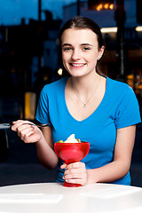 Image showing Girl enjoying tempting dessert