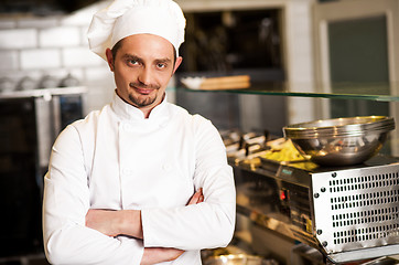 Image showing Confident young chef posing