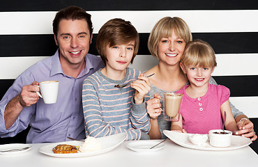 Image showing Family enjoying breakfast at a restaurant