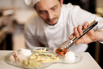 Image showing Finishing touches to the yummy meal