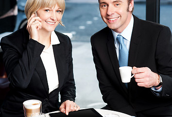 Image showing Two business professionals at coffee shop