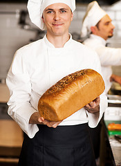 Image showing Chef showing freshly baked whole grain bread