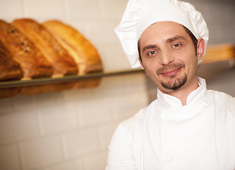 Image showing Bakery owner dressed in chef's attire