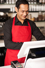 Image showing Barista staff placing customers order in queue