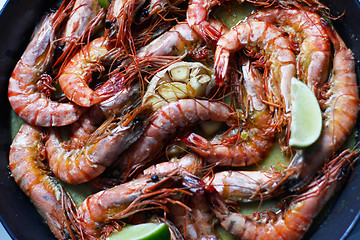 Image showing fried tiger prawns with garlic and lime