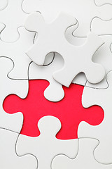 Image showing Missing puzzle piece in red color 