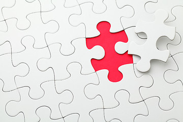 Image showing Puzzle with missing piece in red color 