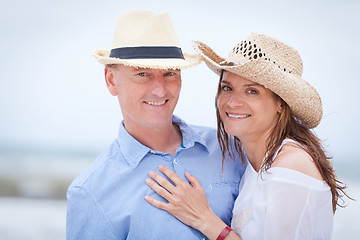 Image showing happy adult couple in summertime on beach 