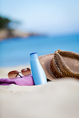 Image showing sunprotection objects on the beach in holiday