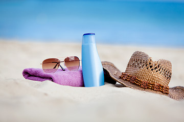 Image showing sunprotection objects on the beach in holiday