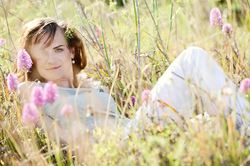 Image showing adult brunette woman smiling in summertime outdoor