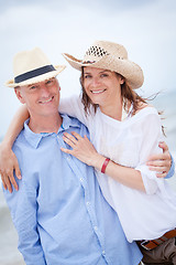 Image showing happy adult couple in summertime on beach 