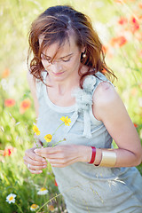 Image showing adult brunette woman smiling in summertime outdoor